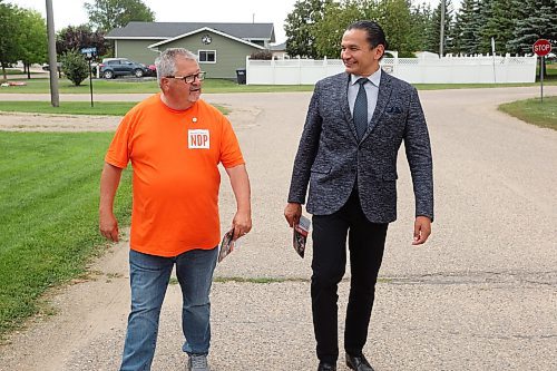 25082025
Spruce Woods NDP candidate Ray Berthelette and NDP leader Wab Kinew walk together in Rivers to knock on doors and meet voters along with volunteers on Monday in the final push ahead of today’s Spruce Woods byelection.
(Tim Smith/The Brandon Sun)