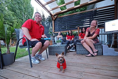 Manitoba Liberal Spruce Woods candidate Stephen Reid spends time with friends and family watching byelection results roll in from his backyard on Tuesday evening. Reid came in a distant third after all the polls were counted. (Matt Goerzen/The Brandon Sun)