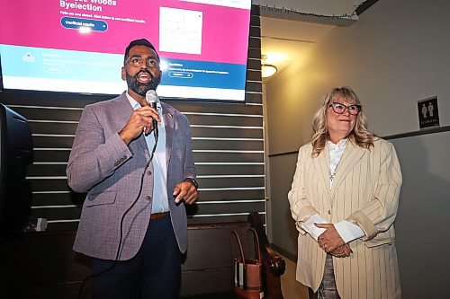 26082025
Progressive Conservative Party of Manitoba candidate Colleen Robbins (R) listens as PC leader Obby Khan speaks at the Woodfire Deli in Souris on Tuesday evening after Robbins was declared the winner in the Spruce Woods byelection. (Tim Smith/The Brandon Sun)