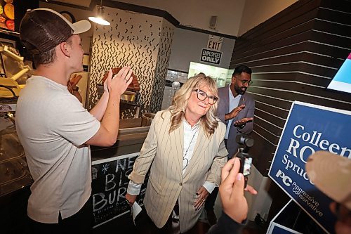 26082025
Manitoba Progressive Conservative candidate Colleen Robbins enters the Woodfire Deli in Souris to cheers from supporters on Tuesday evening after being declared the winner in the Spruce Woods byelection. (Tim Smith/The Brandon Sun)