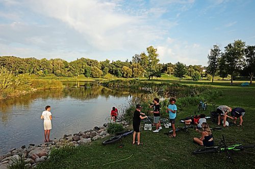 26082025
A group of boys all taking part in the Homegrown Hockey Camp in Souris fish along Plum Creek near where it enters the Souris River in Victoria Park on a warm Tuesday evening. (Tim Smith/The Brandon Sun)
