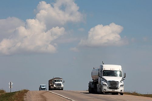 27082025
Semi trailers make their way west along the Trans Canada Highway west of Brandon on Wednesday. (Tim Smith/The Brandon Sun)