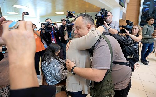 Ruth Bonneville / Free Press 
LOCAL - 60's scoop airport reunion 
Photo of Jonathan Hooker gets emotional as he meets  his biological mom. Patsy George for the 1st time after many years at the airport Wednesday. 
Jonathan Hooker, who was taken from his family in Northern Manitoba in the 1970s, arrives with his wife Charmaine Hooker (green vest) after travelling from their home in New Zealand to meet his biological mom, Patsy George and family at the  James Richardson Winnipeg International Airport Wednesday. 
Story info: He’s one of an estimated 30,000 Indigenous children taken from their homes during what has become known as the Sixties Scoop.  A time period that spanned from 1951-1991. Jonathan was adopted by a white middle-class family in Manitoba, and they moved to New Zealand.  
A big welcome party took place with Drummers and Indigenous leaders, family and friends  to celebrate his return home.    His birth mom, Patsy George with her sister, Flora McNabb (grey sweater), granddaughter Nellie McNabb (rust shirt) and many other family members and friends gather at the airport.
Aug 27th,  2025
