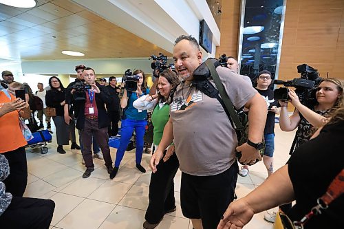 Ruth Bonneville / Free Press
LOCAL - 60's scoop airport reunion
Photo of Jonathan Hooker gets emotional as he makes his way over to meet his biological mom. Patsy George for the 1st time after many years at the airport Wednesday. His wife Charmaine Hooker (green vest), is by his side.
Jonathan Hooker, who was taken from his family in Northern Manitoba in the 1970s, arrives with his wife Charmaine Hooker (green vest) after travelling from their home in New Zealand to meet his biological mom, Patsy George and family at the James Richardson Winnipeg International Airport Wednesday.
Story info: He’s one of an estimated 30,000 Indigenous children taken from their homes during what has become known as the Sixties Scoop. A time period that spanned from 1951-1991. Jonathan was adopted by a white middle-class family in Manitoba, and they moved to New Zealand.
A big welcome party took place with Drummers and Indigenous leaders, family and friends to celebrate his return home. His birth mom, Patsy George with her sister, Flora McNabb (grey sweater), granddaughter Nellie McNabb (rust shirt) and many other family members and friends gather at the airport.
Aug 27th, 2025