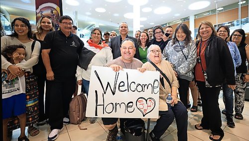 Ruth Bonneville / Free Press
LOCAL - 60's scoop airport reunion
Photo of Jonathan Hooker with his biological mom. Patsy George, having a group shot taken with family and friends after they met for the1st time after many years at the airport Wednesday.
Jonathan Hooker, who was taken from his family in Northern Manitoba in the 1970s, arrives with his wife Charmaine Hooker (green vest) after travelling from their home in New Zealand to meet his biological mom, Patsy George and family at the James Richardson Winnipeg International Airport Wednesday.
Story info: He’s one of an estimated 30,000 Indigenous children taken from their homes during what has become known as the Sixties Scoop. A time period that spanned from 1951-1991. Jonathan was adopted by a white middle-class family in Manitoba, and they moved to New Zealand.
A big welcome party took place with Drummers and Indigenous leaders, family and friends to celebrate his return home. His birth mom, Patsy George with her sister, Flora McNabb (grey sweater), granddaughter Nellie McNabb (rust shirt) and many other family members and friends gather at the airport.
Aug 27th, 2025