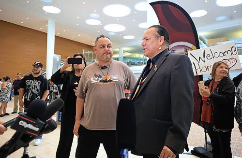 Ruth Bonneville / Free Press 
LOCAL - 60's scoop airport reunion 
Grand Chief Garrison Settee talks to the media about the reunion of Jonathan Hooker with his mom Patsy George at the airport Wednesday. 
Jonathan Hooker, who was taken from his family in Northern Manitoba in the 1970s, arrives with his wife Charmaine Hooker (green vest) after travelling from their home in New Zealand to meet his biological mom, Patsy George and family at the  James Richardson Winnipeg International Airport Wednesday. 
Story info: He’s one of an estimated 30,000 Indigenous children taken from their homes during what has become known as the Sixties Scoop.  A time period that spanned from 1951-1991. Jonathan was adopted by a white middle-class family in Manitoba, and they moved to New Zealand.  
A big welcome party took place with Drummers and Indigenous leaders, family and friends  to celebrate his return home.    His birth mom, Patsy George with her sister, Flora McNabb (grey sweater), granddaughter Nellie McNabb (rust shirt) and many other family members and friends gather at the airport.
Aug 27th,  2025