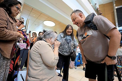 Ruth Bonneville / Free Press 
LOCAL - 60's scoop airport reunion 
Photo of Jonathan Hooker gets emotional as he meets  his biological mom. Patsy George for the 1st time after many years at the airport Wednesday.
Jonathan Hooker, who was taken from his family in Northern Manitoba in the 1970s, arrives with his wife Charmaine Hooker (green vest) after travelling from their home in New Zealand to meet his biological mom, Patsy George and family at the  James Richardson Winnipeg International Airport Wednesday. 
Story info: He’s one of an estimated 30,000 Indigenous children taken from their homes during what has become known as the Sixties Scoop.  A time period that spanned from 1951-1991. Jonathan was adopted by a white middle-class family in Manitoba, and they moved to New Zealand.  
A big welcome party took place with Drummers and Indigenous leaders, family and friends  to celebrate his return home.    His birth mom, Patsy George with her sister, Flora McNabb (grey sweater), granddaughter Nellie McNabb (rust shirt) and many other family members and friends gather at the airport.
Aug 27th,  2025