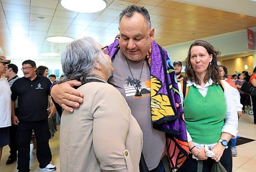 Ruth Bonneville / Free Press
LOCAL - 60's scoop airport reunion
Photo of Jonathan Hooker gets emotional as he meets his biological mom. Patsy George for the 1st time after many years at the airport Wednesday. His wife Charmaine Hooker (green vest), is by his side.
Jonathan Hooker, who was taken from his family in Northern Manitoba in the 1970s, arrives with his wife Charmaine Hooker (green vest) after travelling from their home in New Zealand to meet his biological mom, Patsy George and family at the James Richardson Winnipeg International Airport Wednesday.
Story info: He’s one of an estimated 30,000 Indigenous children taken from their homes during what has become known as the Sixties Scoop. A time period that spanned from 1951-1991. Jonathan was adopted by a white middle-class family in Manitoba, and they moved to New Zealand.
A big welcome party took place with Drummers and Indigenous leaders, family and friends to celebrate his return home. His birth mom, Patsy George with her sister, Flora McNabb (grey sweater), granddaughter Nellie McNabb (rust shirt) and many other family members and friends gather at the airport.
Aug 27th, 2025