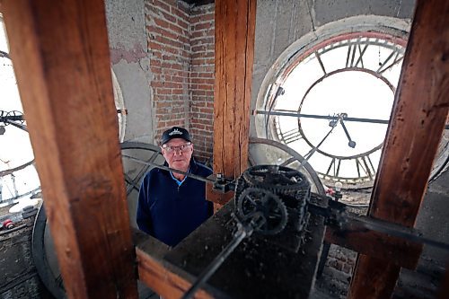 Minnedosa Coun. Grant Butler is seen in the clock tower above Main Street in Minnedosa. Butler has volunteered to keep the clock ticking for the foreseeable future after a visit from a restoration professional. (Connor McDowell/The Brandon Sun)