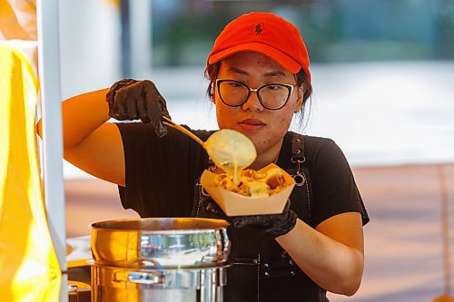 MIKE DEAL / FREE PRESS
Hannah Nguyen and Alain Pham at their station, Toasty Alley, a two-month old operation that sells croffles - a cross between croissants and waffles. The dish was created around 2018 in Korea, and has since spread around the world. Hannah and Alain (married) offer different flavours, including s'mores, pistachio and bacon-and-onions.
Reporter: Dave Sanderson
250828 - Thursday, August 28, 2025.