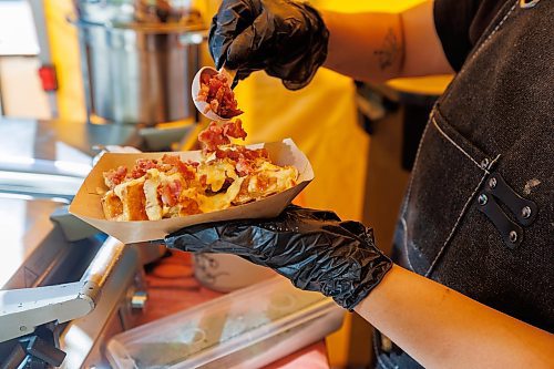 MIKE DEAL / FREE PRESS
Hannah Nguyen and Alain Pham at their station, Toasty Alley, a two-month old operation that sells croffles - a cross between croissants and waffles. The dish was created around 2018 in Korea, and has since spread around the world. Hannah and Alain (married) offer different flavours, including s'mores, pistachio and bacon-and-onions.
Reporter: Dave Sanderson
250828 - Thursday, August 28, 2025.