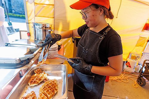 MIKE DEAL / FREE PRESS
Hannah Nguyen and Alain Pham at their station, Toasty Alley, a two-month old operation that sells croffles - a cross between croissants and waffles. The dish was created around 2018 in Korea, and has since spread around the world. Hannah and Alain (married) offer different flavours, including s'mores, pistachio and bacon-and-onions.
Reporter: Dave Sanderson
250828 - Thursday, August 28, 2025.