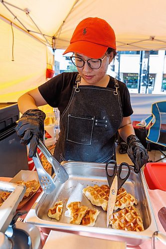 MIKE DEAL / FREE PRESS
Hannah Nguyen and Alain Pham at their station, Toasty Alley, a two-month old operation that sells croffles - a cross between croissants and waffles. The dish was created around 2018 in Korea, and has since spread around the world. Hannah and Alain (married) offer different flavours, including s'mores, pistachio and bacon-and-onions.
Reporter: Dave Sanderson
250828 - Thursday, August 28, 2025.