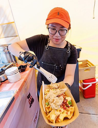 MIKE DEAL / FREE PRESS
Hannah Nguyen and Alain Pham at their station, Toasty Alley, a two-month old operation that sells croffles - a cross between croissants and waffles. The dish was created around 2018 in Korea, and has since spread around the world. Hannah and Alain (married) offer different flavours, including s&#039;mores, pistachio and bacon-and-onions.
Reporter: Dave Sanderson
250828 - Thursday, August 28, 2025.