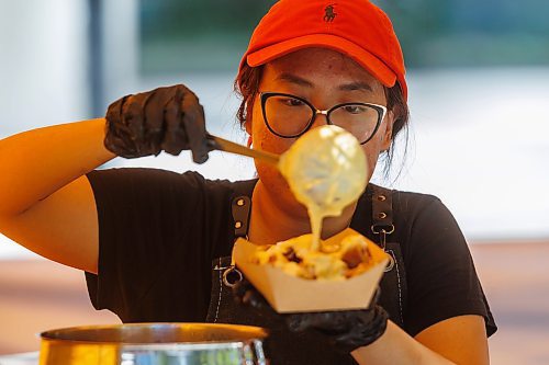 MIKE DEAL / FREE PRESS
Hannah Nguyen and Alain Pham at their station, Toasty Alley, a two-month old operation that sells croffles - a cross between croissants and waffles. The dish was created around 2018 in Korea, and has since spread around the world. Hannah and Alain (married) offer different flavours, including s'mores, pistachio and bacon-and-onions.
Reporter: Dave Sanderson
250828 - Thursday, August 28, 2025.