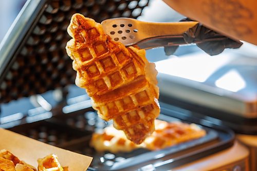 MIKE DEAL / FREE PRESS
Hannah Nguyen and Alain Pham at their station, Toasty Alley, a two-month old operation that sells croffles - a cross between croissants and waffles. The dish was created around 2018 in Korea, and has since spread around the world. Hannah and Alain (married) offer different flavours, including s'mores, pistachio and bacon-and-onions.
Reporter: Dave Sanderson
250828 - Thursday, August 28, 2025.