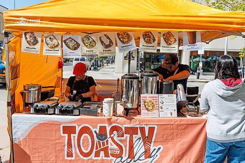 MIKE DEAL / FREE PRESS
Hannah Nguyen and Alain Pham at their station, Toasty Alley, a two-month old operation that sells croffles - a cross between croissants and waffles. The dish was created around 2018 in Korea, and has since spread around the world. Hannah and Alain (married) offer different flavours, including s'mores, pistachio and bacon-and-onions.
Reporter: Dave Sanderson
250828 - Thursday, August 28, 2025.