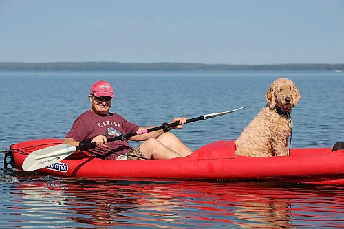 28082025
Mike Kusyk and his dog Dasha paddle on Clear Lake in Riding Mountain National Park on a hot and sunny Thursday afternoon. 
(Tim Smith/The Brandon Sun)