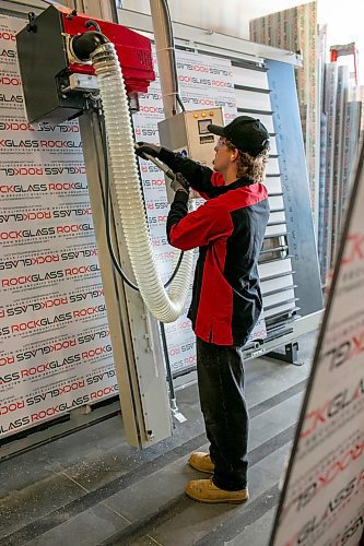 BROOK JONES/FREE PRESS
ClearSecure Manufacturing & Distribution is best known for RockGlass, a window security system through impact-resistant windows and doors. The local company is located in CentrePort Canada at 8-3149 Red Fife Rd. in the RM of Rosser, Man. ClearSecure fabricator Braeden Hay is pictured operating a vertical panel saw while working at the manufacturing and distribution plant on Tuesday, Aug. 19, 2025.