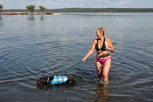 28082025
Cynthia Lovering takes her dog Tucker for a swim in Clear Lake in Riding Mountain National Park on Thursday. 
(Tim Smith/The Brandon Sun)
