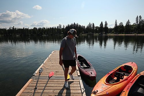 28082025
Adam Vanstone readies kayaks for customers while working at The Clear Lake Marina in Riding Mountain National Park on Thursday.
(Tim Smith/The Brandon Sun)