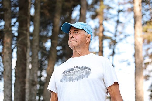 28082025
Kevin Beresford of Stonewall, during a walk along Clear Lake in Riding Mountain National Park on Thursday. Beresford has a year-round home in the park.
(Tim Smith/The Brandon Sun)