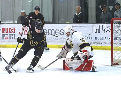 Team Black forward Carter Klippenstein (19) watches the puck as Team White goalie Joffrey Chan (30) makes a pad save as the Brandon Wheat Kings closed their training camp with the annual Black and Gold game at J&G Homes Arena on Monday. (Perry Bergson/The Brandon Sun)
Sept. 1, 2025