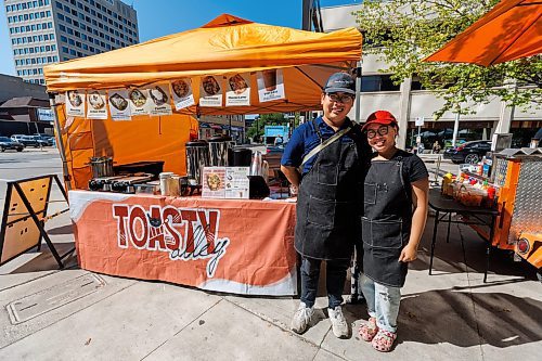 MIKE DEAL / FREE PRESS
Hannah Nguyen and Alain Pham at their station, Toasty Alley, a two-month old operation that sells croffles - a cross between croissants and waffles. The dish was created around 2018 in Korea, and has since spread around the world. Hannah and Alain (married) offer different flavours, including s'mores, pistachio and bacon-and-onions.
Reporter: Dave Sanderson
250828 - Thursday, August 28, 2025.