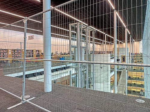 MIKE DEAL / FREE PRESS
The Millennium library’s fourth floor reopened Tuesday with additional safety measures including a portable metal fence keeping people away from the railing, following a suicide earlier this month.
Reporter: Nicole Buffie
250902 - Tuesday, September 02, 2025.