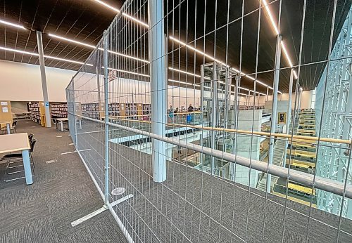 MIKE DEAL / FREE PRESS
The Millennium library’s fourth floor reopened Tuesday with additional safety measures including a portable metal fence keeping people away from the railing, following a suicide earlier this month.
Reporter: Nicole Buffie
250902 - Tuesday, September 02, 2025.