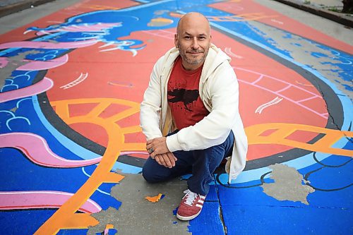 Ruth Bonneville / Free Press
ENT - Prairie Comics Festival
Comic artists Mike Zastre has his photo taken on the mural he painted on Graham Ave., near Millennium Library Wednesday.
Mike Zastre is one of over 90 artists sharing their work at this weekend's free Prairie Comics Festival at the Manitoba Museum. He's also been tasked with designing an illustrated land acknowledgement. In a comic grid with each box shaped like a letter in the term "Landback," Zastre -- a Métis artist -- paid respect to the land and the water with a focus on stewardship.
Ben Waldman story.
Sept 3rd,, 2025