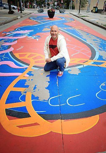 Ruth Bonneville / Free Press
ENT - Prairie Comics Festival
Comic artists Mike Zastre has his photo taken on the mural he painted on Graham Ave., near Millennium Library Wednesday.
Mike Zastre is one of over 90 artists sharing their work at this weekend's free Prairie Comics Festival at the Manitoba Museum. He's also been tasked with designing an illustrated land acknowledgement. In a comic grid with each box shaped like a letter in the term "Landback," Zastre -- a Métis artist -- paid respect to the land and the water with a focus on stewardship.
Ben Waldman story.
Sept 3rd,, 2025