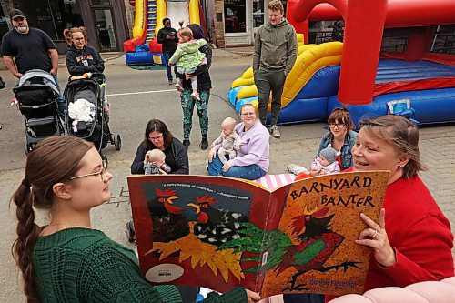 29082025
Leah Stephens and Robin Stewart with the Brandon Public Library read to children and their parents during the final Downtown Summer Market of the season on Rosser Avenue in downtown Brandon on Wednesday.
Tim Smith/The Brandon Sun)