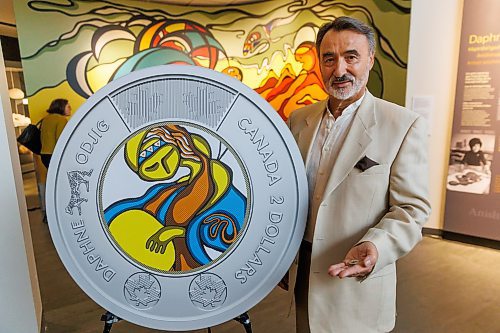 MIKE DEAL / FREE PRESS
Stan Somerville, son of artist Daphne Odjig, holds one of the coins.
The Royal Canadian Mint unveils a special two-dollar circulation coin recognizing artist, Daphne Odjig, and her contributions to the transformation of Indigenous art at a ceremony inside the Manitoba Museum in front of a mural she painted in 1972 titled, The Creation of the World.
250904 - Thursday, September 04, 2025.