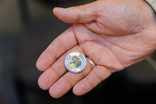 MIKE DEAL / FREE PRESS
Stan Somerville, son of artist Daphne Odjig, holds one of the coins.
The Royal Canadian Mint unveils a special two-dollar circulation coin recognizing artist, Daphne Odjig, and her contributions to the transformation of Indigenous art at a ceremony inside the Manitoba Museum in front of a mural she painted in 1972 titled, The Creation of the World.
250904 - Thursday, September 04, 2025.