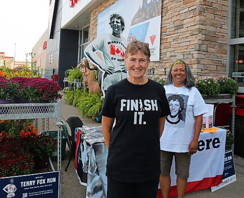 Heather Stewart (left) and Trish Toth, volunteers with the Terry Fox Foundation, are taking donations and registrations for this Sunday's Terry Fox Run outside the Brandon location of Canadian Tire each day this week from 1 to 6 p.m. (Michele McDougall/The Brandon Sun)
