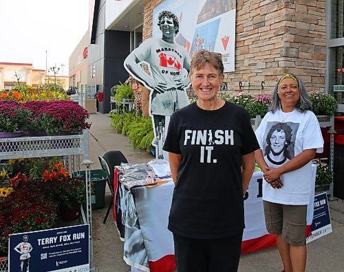 Heather Stewart (left) and Trish Toth, volunteers with the Terry Fox Foundation, are taking donations and registrations for this Sunday's Terry Fox Run outside the Brandon location of Canadian Tire each day this week from 1 to 6 p.m. (Michele McDougall/The Brandon Sun)