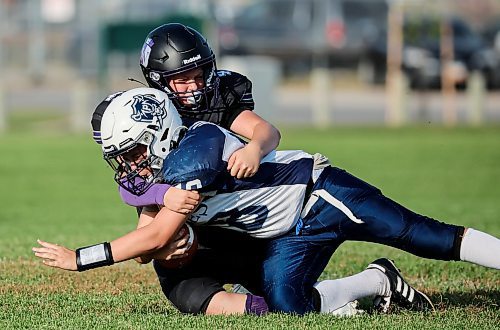 JOHN WOODS / FREE PRESS
Windsor Park Collegiate Royals&#x2019; Benjamin Brown (43) sacks Grant Park Pirates quarterback Will Manning (18) in their JV9 game at Falcons Football Club field Tuesday, September 9, 2025. This is the first game for Windsor Park&#x2019;s new team. 

Reporter: josh