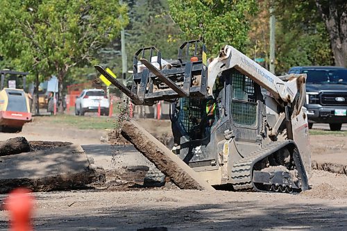 A construction worker breaks up pavement on First Street near Queens Avenue on Wednesday afternoon. (Matt Goerzen/The Brandon Sun)