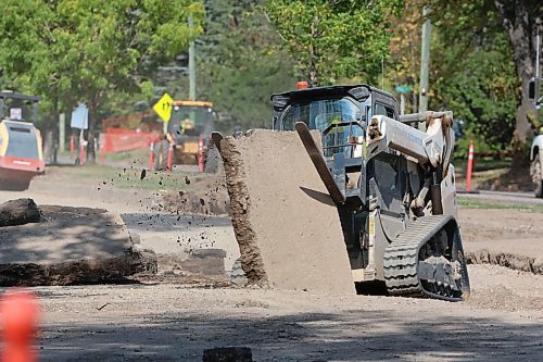 A construction worker breaks up pavement on First Street near Queens Avenue on Wednesday afternoon. (Matt Goerzen/The Brandon Sun)