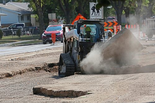 A construction worker breaks up pavement on First Street near Queens Avenue on Wednesday afternoon. (Matt Goerzen/The Brandon Sun)