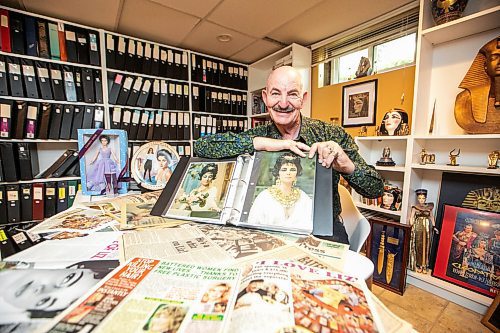 MIKAELA MACKENZIE / FREE PRESS

Hannon Bell with some of his Elizabeth Taylor collection (and articles about his collecting over the years) on Tuesday, Sept. 9, 2025. Behind him on the shelf are over 120 three-ring binders filled with photos and news articles about the actress.

For Dave Sanderson story.
Free Press 2025