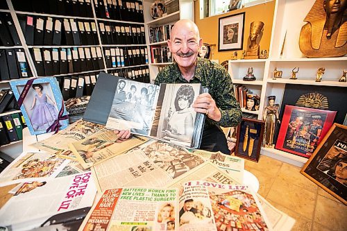 MIKAELA MACKENZIE / FREE PRESS

Hannon Bell with some of his Elizabeth Taylor collection (and articles about his collecting over the years) on Tuesday, Sept. 9, 2025. Behind him on the shelf are over 120 three-ring binders filled with photos and news articles about the actress.

For Dave Sanderson story.
Free Press 2025