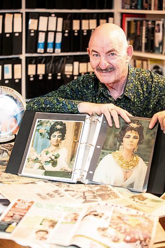 MIKAELA MACKENZIE / FREE PRESS
Hannon Bell with some of his Elizabeth Taylor collection (and articles about his collecting over the years) on Tuesday, Sept. 9, 2025. Behind him on the shelf are over 120 three-ring binders filled with photos and news articles about the actress.
For Dave Sanderson story.
Free Press 2025