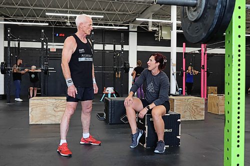17092025
Doug Murray chats with his coach Jenn McMillan, co-owner of Rocked Community Fitness, while training at the gym in Brandon on Tuesday. Murray placed fourth in the world in his age group at the 2025 Age-Group CrossFit Games in Columbus, Ohio in August. 
(Tim Smith/The Brandon Sun)