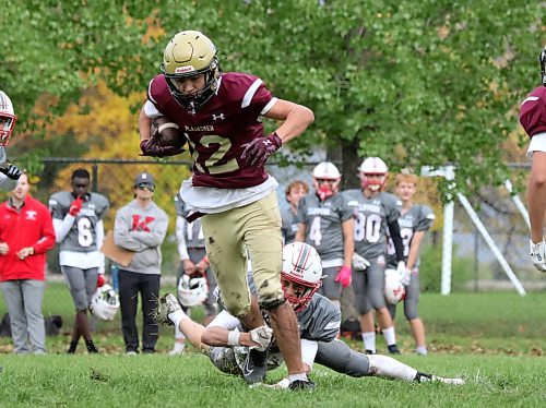 Crocus Plainsmen receiver Maurice Chartrand tries to break a Kelvin Clippers tackle. (Thomas Friesen/The Brandon Sun)