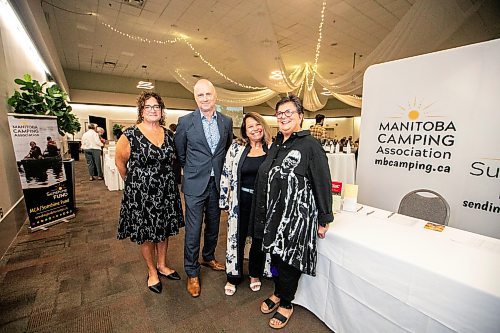 MIKAELA MACKENZIE / FREE PRESS

Kim Scherger, exective director of the Manitoba Camping Association (left), Paul Samyn, Free Press editor-in-chief, and storytellers Angela Recio de Garcia and Bonnie Robinson at the Sunshine Fund Donor Appreciation Luncheon at the Caboto Centre on Thursday, Sept. 18, 2025.

For &#x460;story.
Free Press 2025