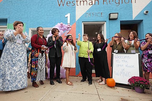 18092025
Terry Deller, one of the founding members of the Western Manitoba Women's Centre, is surrounded by staff, while cutting the ribbon during the grand opening of the centre’s new location in the 1200 block of Rosser Avenue on Thursday.
(Tim Smith/The Brandon Sun)