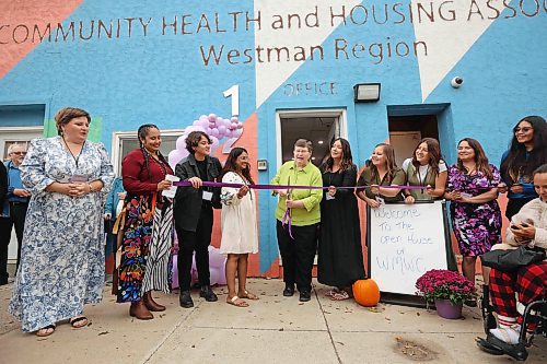18092025
Terry Deller, one of the founding members of the Western Manitoba Women's Centre, is surrounded by staff, while cutting the ribbon during the grand opening of the centre’s new location in the 1200 block of Rosser Avenue on Thursday.
(Tim Smith/The Brandon Sun)