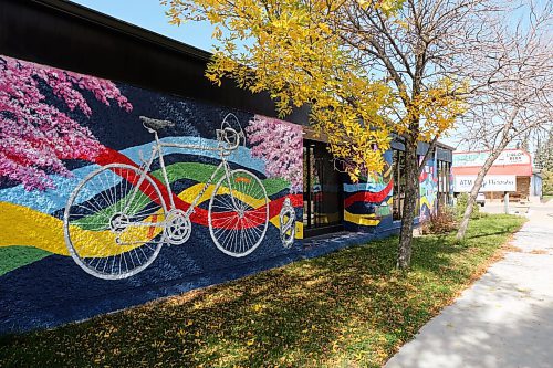 The Sekine bicycle mural on the side of Westoba Credit Union in Rivers. Cherry blossoms and ribbons decorate the bicycle mural in an homage to Japanese and Indigenous culture. (Connor McDowell/The Brandon Sun)